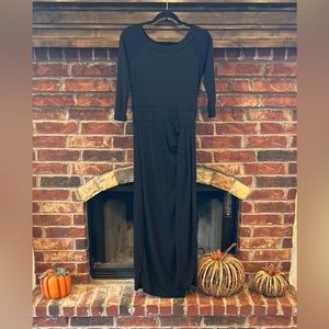 Shimmering black evening dress with high left slit